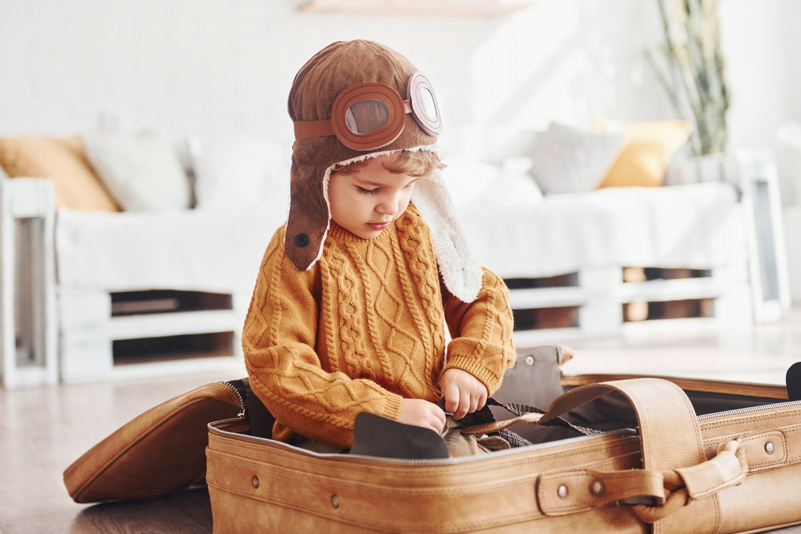 little-boys-in-retro-pilot-costume-have-fun-and-sitting-in-suitcase-indoors-at-daytime.jpg little-boys-in-retro-pilot-costume-have-fun-and-sitting-in-suitcase-indoors-at-daytime.jpg